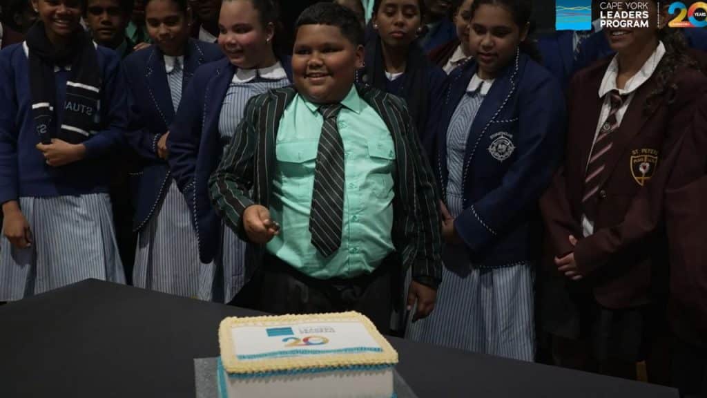 Boy about to cut cake