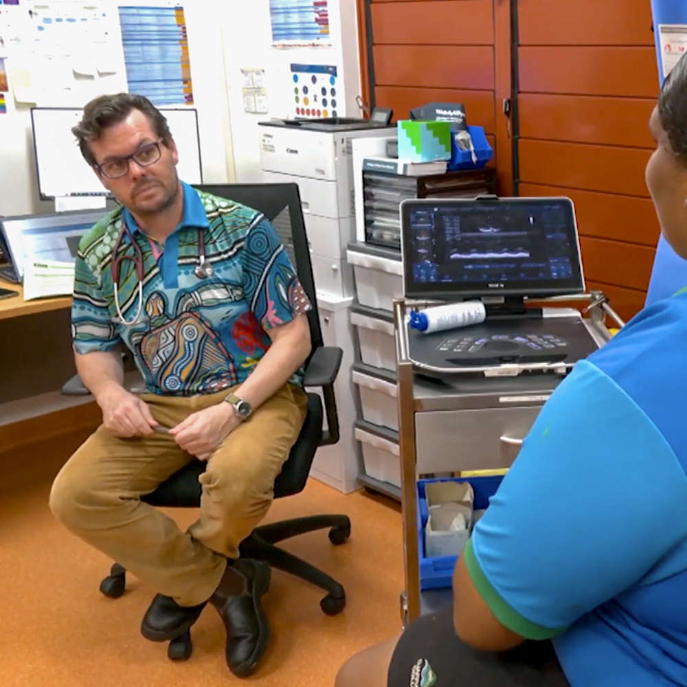 Dr. Ben Reeves in a consultaion with a Djarragun College student