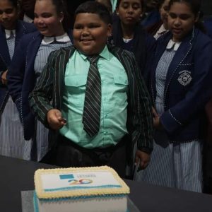 Boy about to cut cake